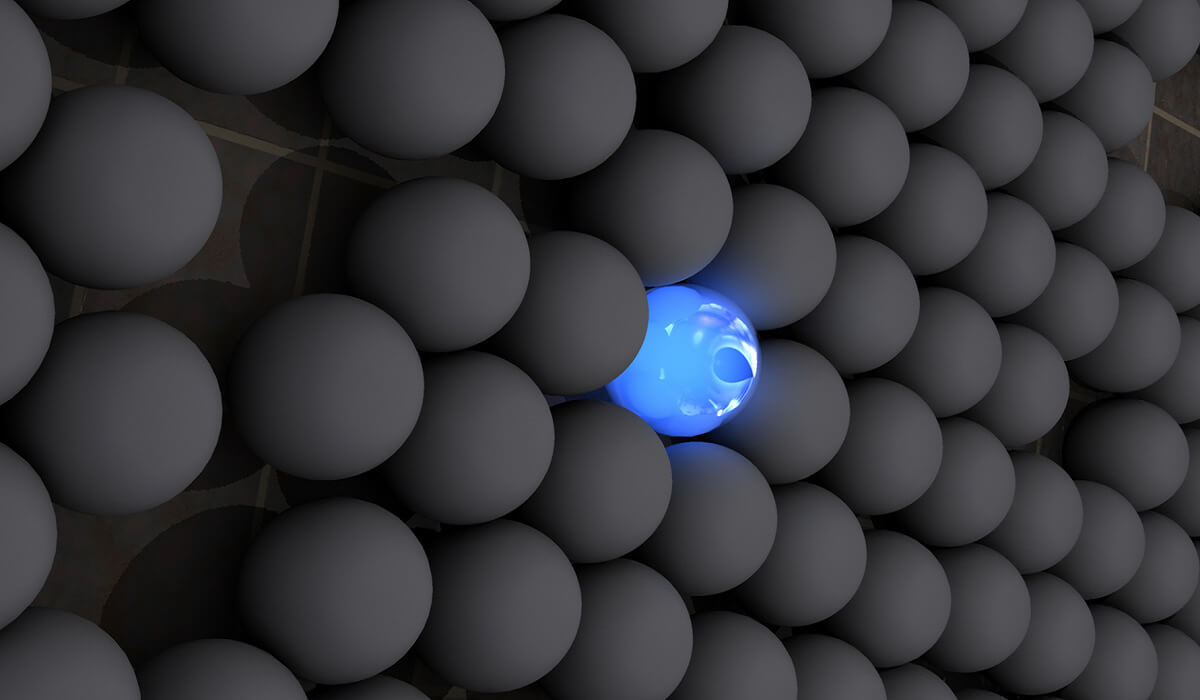 A blue ball in a sea of grey.